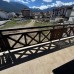 Bright apartment with a fireplace, open-plan kitchen, and balcony with mountain views in a ski resort